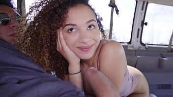 A charming African-American teenager gives a passionate blowjob before experiencing intense intercourse in a van